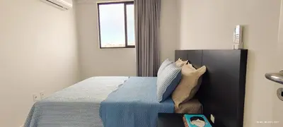 Uma cama ou camas num quarto em Apto 1 suite e 1 quarto, sacada com churrasqueira