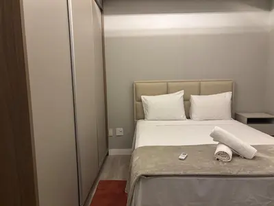 Uma cama ou camas num quarto em 4 Suítes • Playground Privativo • Churrasqueira