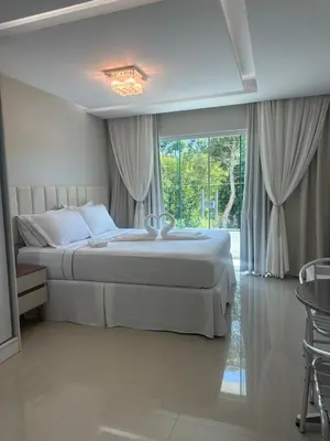 Uma cama ou camas num quarto em Aconchego da vila