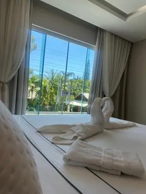 Uma cama ou camas num quarto em Aconchego da vila