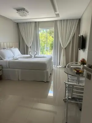 Uma cama ou camas num quarto em Aconchego da vila