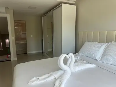 Uma cama ou camas num quarto em Aconchego da vila