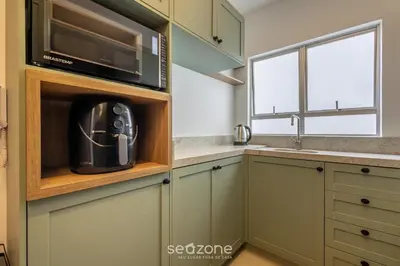 A cozinha ou kitchenette de Conforto e Praticidade a 350 m do mar em Balneário Camboriú - RLPs