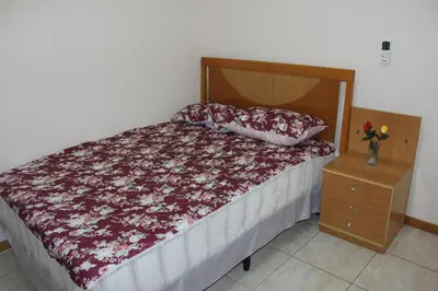 Uma cama ou camas num quarto em Apartamento em Meia Praia
