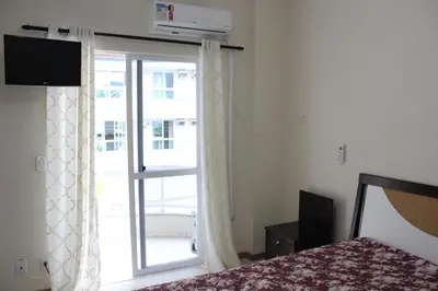 Uma cama ou camas num quarto em Apartamento em Meia Praia