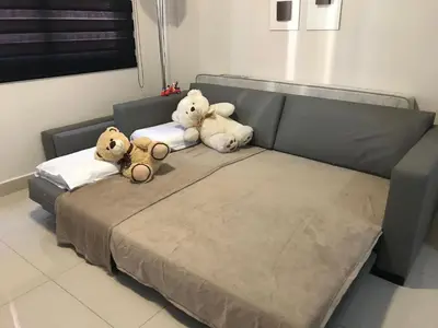 Uma cama ou camas num quarto em Edifício Vila Real