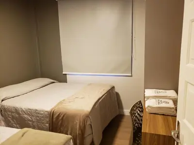 Uma cama ou camas num quarto em Edifício Vila Real