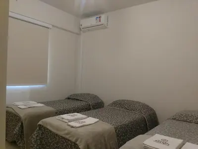 Uma cama ou camas num quarto em Edifício Vila Real