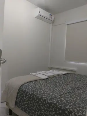 Uma cama ou camas num quarto em Edifício Vila Real