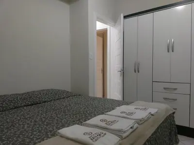 Uma cama ou camas num quarto em Edifício Vila Real