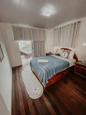 Uma cama ou camas num quarto em Pousada Canto do Pescador