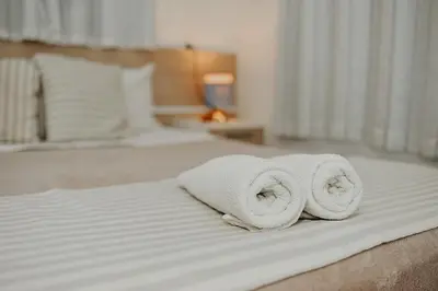 Uma cama ou camas num quarto em Pousada Canto do Pescador