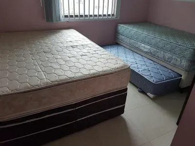 Uma cama ou camas num quarto em Novo Lar 1 Bombinhas (Eliseos)