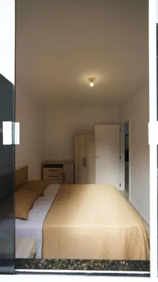 Uma cama ou camas num quarto em Residencial Maria Idia