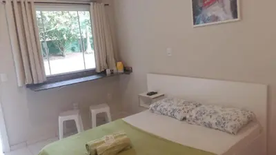 Uma cama ou camas num quarto em Pousada Camping Bombinhas