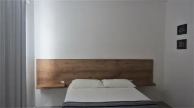 Uma cama ou camas num quarto em Residencial Marbella