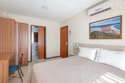 Uma cama ou camas num quarto em Residencial Onda Azul