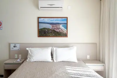 Uma cama ou camas num quarto em Residencial Onda Azul