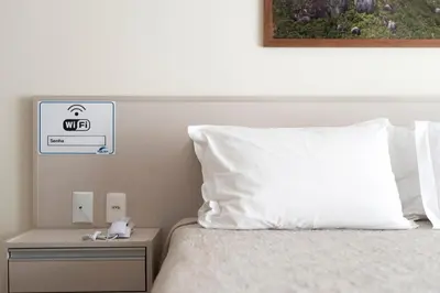 Uma cama ou camas num quarto em Residencial Onda Azul