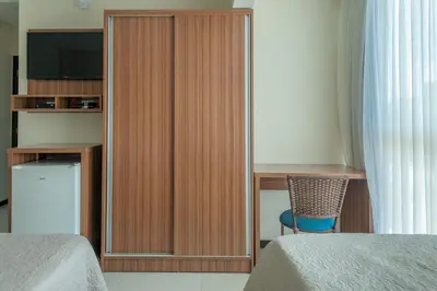 Uma cama ou camas num quarto em Residencial Onda Azul