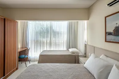 Uma cama ou camas num quarto em Residencial Onda Azul