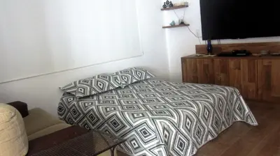 Uma cama ou camas num quarto em loft lindo em Mariscal
