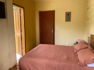 Uma cama ou camas num quarto em O Costão do Sol