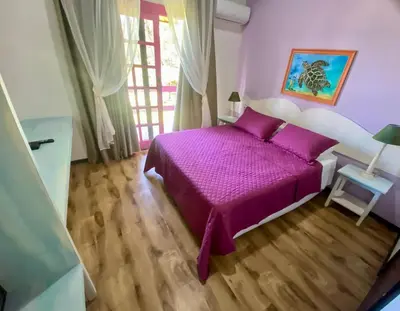 Uma cama ou camas num quarto em O Costão do Sol