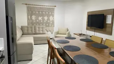 Uma televisão e/ou sistema de entretenimento em Casa em Bombinhas Almeida e Moraes Perto da Praia