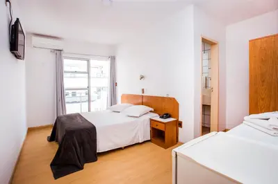 Uma cama ou camas num quarto em Hotel Itapema Meia Praia