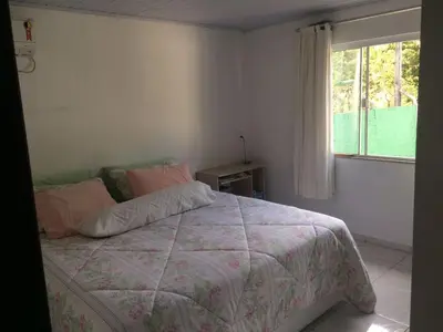 Uma cama ou camas num quarto em Casa paraíso estaleirinho Balneário Camboriú