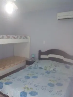 Uma cama ou camas num quarto em Residencial Susy