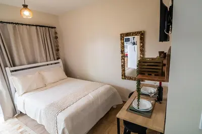 Uma cama ou camas num quarto em Hospedagem Morada Nativa Praia Bombas