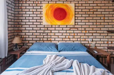 Uma cama ou camas num quarto em Pousada Canto das Trilhas