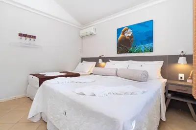 Uma cama ou camas num quarto em 5 quartos piscina e espaço Gourmet (casasmariscal)