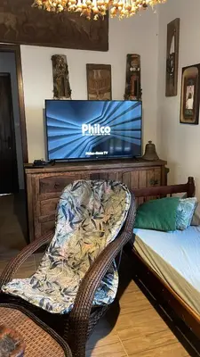 Uma cama ou camas num quarto em Casa Marrom