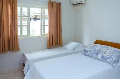 Uma cama ou camas num quarto em Residencial Gonçalves I