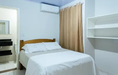 Uma cama ou camas num quarto em Residencial Gonçalves I