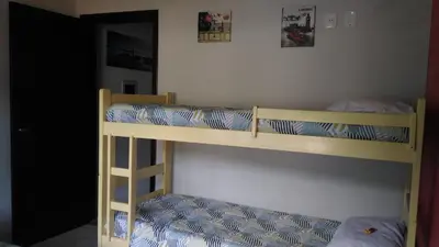 Uma cama ou camas num quarto em Apartamento Bay Conceicao