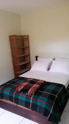 Uma cama ou camas num quarto em Casas na Praia de Bombas - Bombinhas