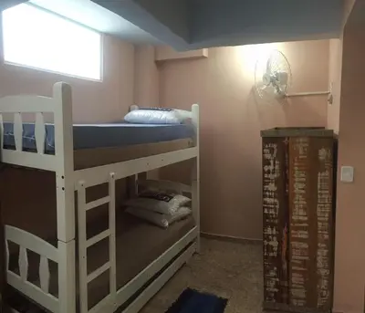 Uma cama ou camas num quarto em Residencial Samuel