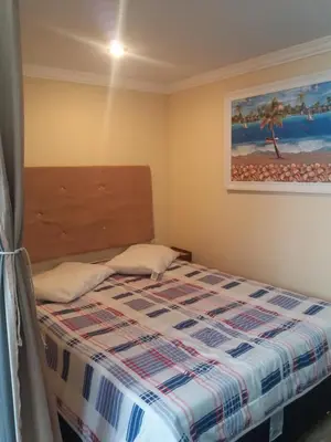 Uma cama ou camas num quarto em Residencial Samuel