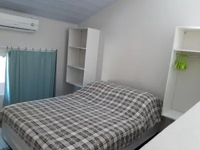 Uma cama ou camas num quarto em Casa do Nei