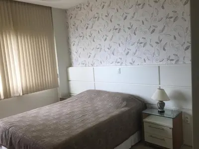 Uma cama ou camas num quarto em Edificio Estrela Dourada