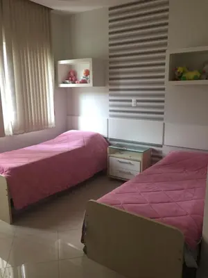 Uma cama ou camas num quarto em Edificio Estrela Dourada