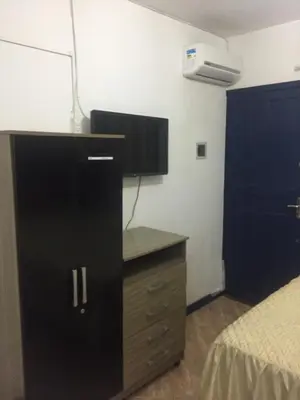 Uma cama ou camas num quarto em Pousada Alessandra