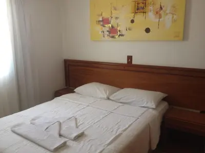 Uma cama ou camas num quarto em Raio do Sol Residence