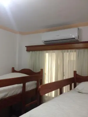 Uma cama ou camas num quarto em Raio do Sol Residence