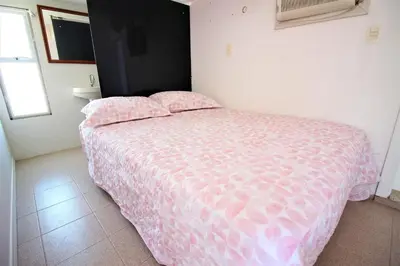 Uma cama ou camas num quarto em Casa Beira Mar