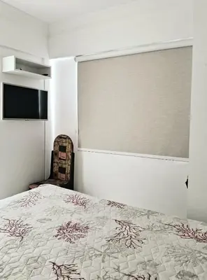 Uma cama ou camas num quarto em Residencial Atalanta